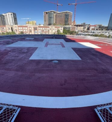 Building rooftop with helicopter landing pad