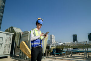 worker performing a data center roof inspection