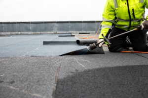 worker performing roof repairs at a hospital