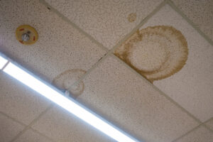 water stained ceiling tiles in a hospital