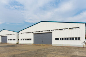 multiple warehouse buildings requiring roof repairs