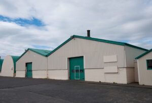 multiple industrial buildings needing roof repairs