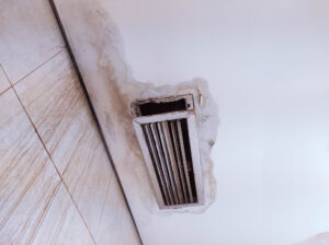 Water damage around a ceiling vent.